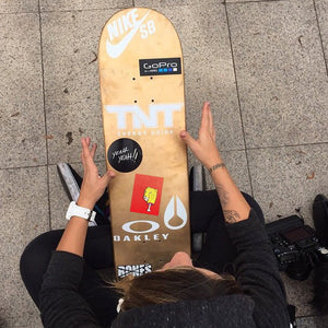 Skateboard holding his skateboard with various skateboard stickers and decals Skateboard Stickers image