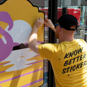 Employee installing a custom window decal Window Decals image